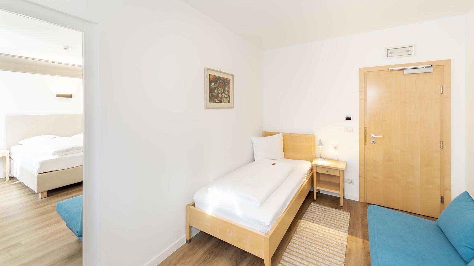 View of a single bed in one of the rooms of the Hotel Hanny in Bolzano