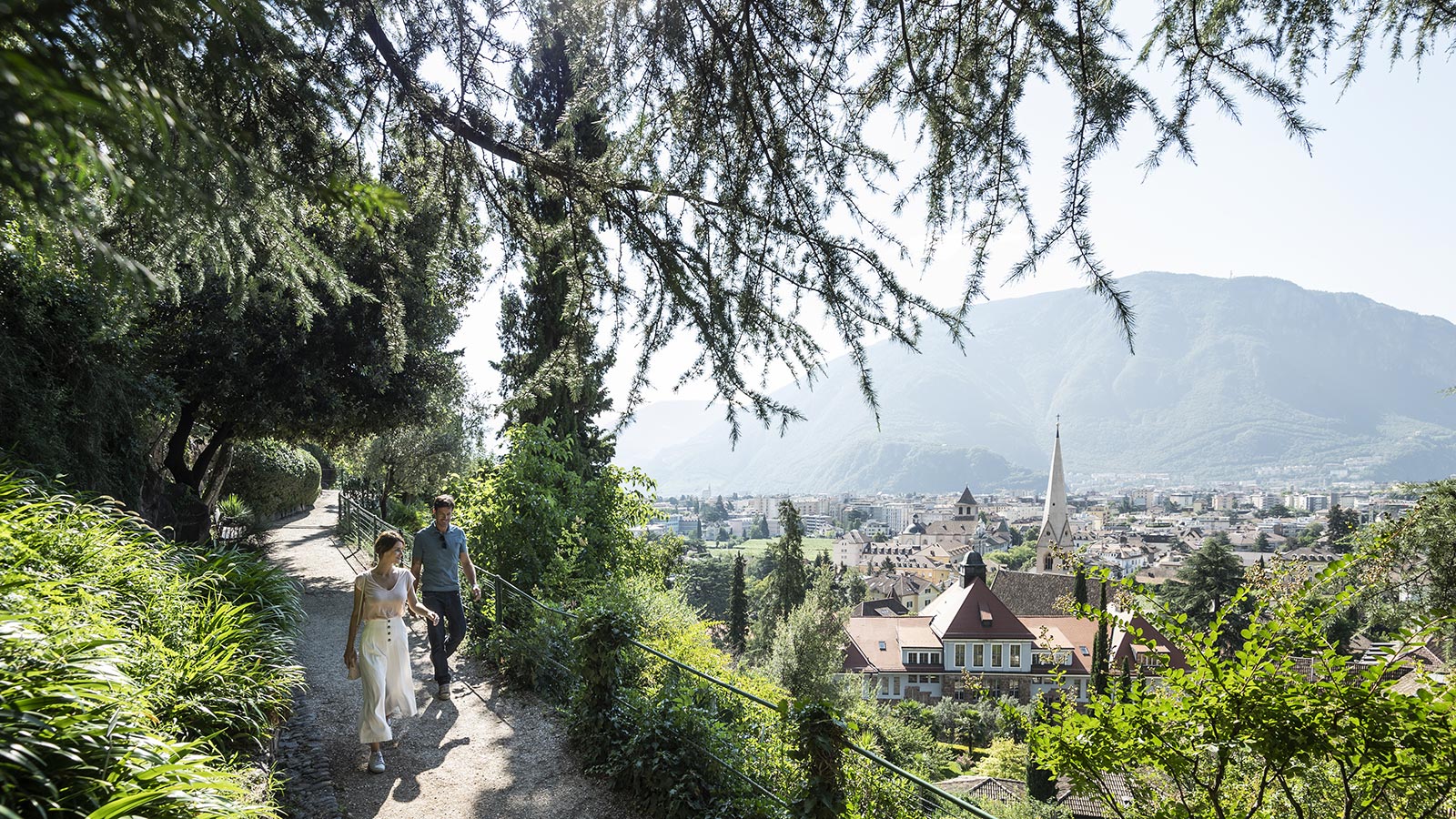 A couple enjoy a walk in the surrounding of Bolzano
